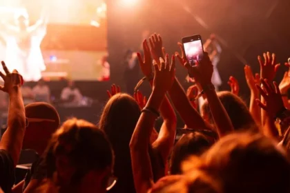 Fans Split on Phone Bans at Concerts Like Harry Styles