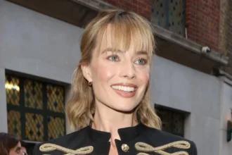 Margot Robbie Stuns in McQueen Military Jacket at 1536 Premiere